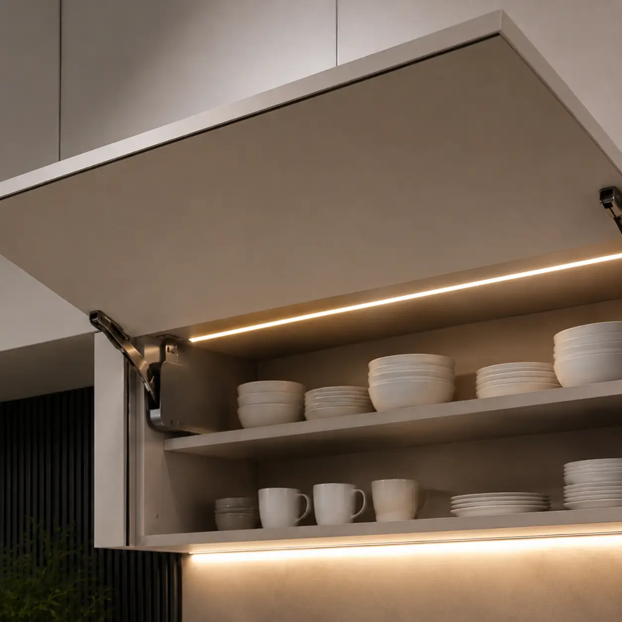 Modular kitchen wall cabinet with lift-up mechanism for easy access to crockery and kitchen essentials